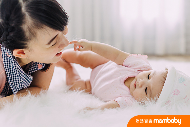 Family portrait of Asian people : 4 months baby feeling happy loving and smiles while playing with her mother.